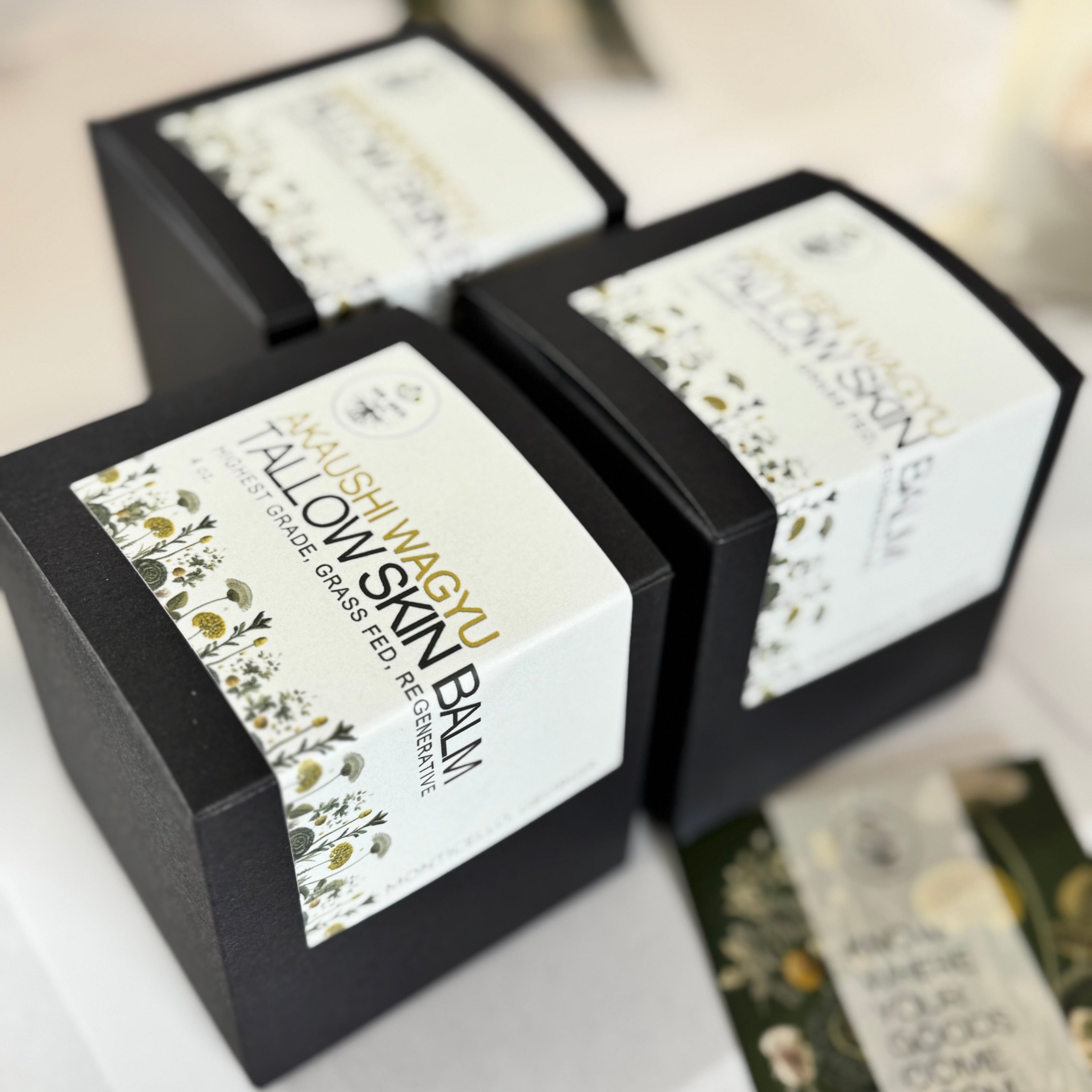Fallow Skin Balm packaging with decorative labels on a white surface