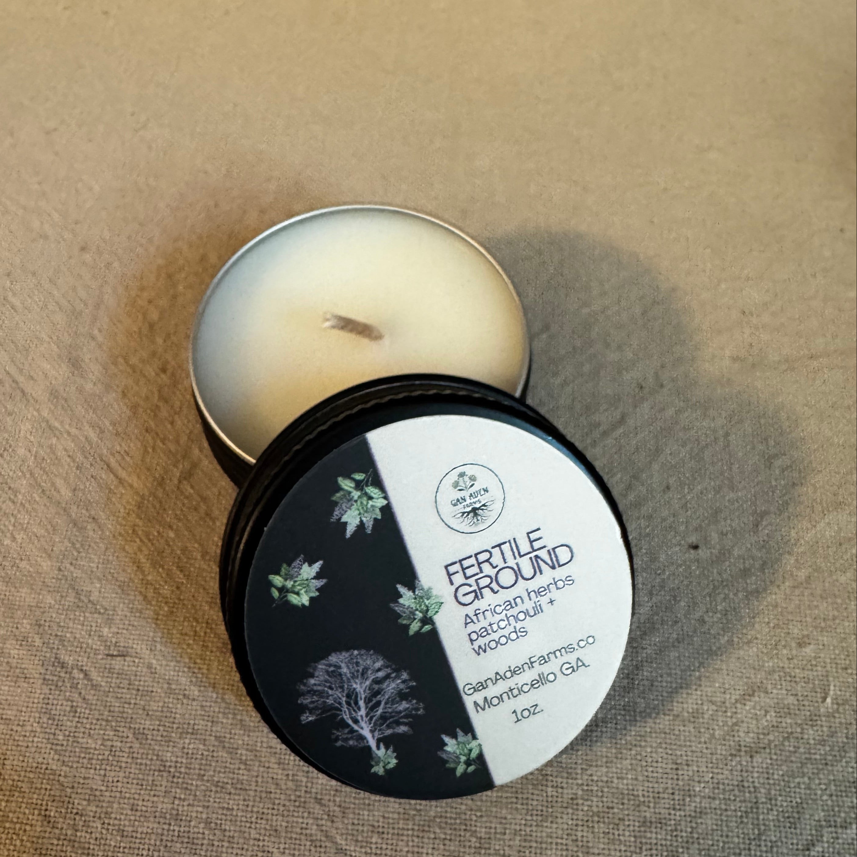Fertile Ground, patchouli African herbs + woods Tea Light Candle Tin